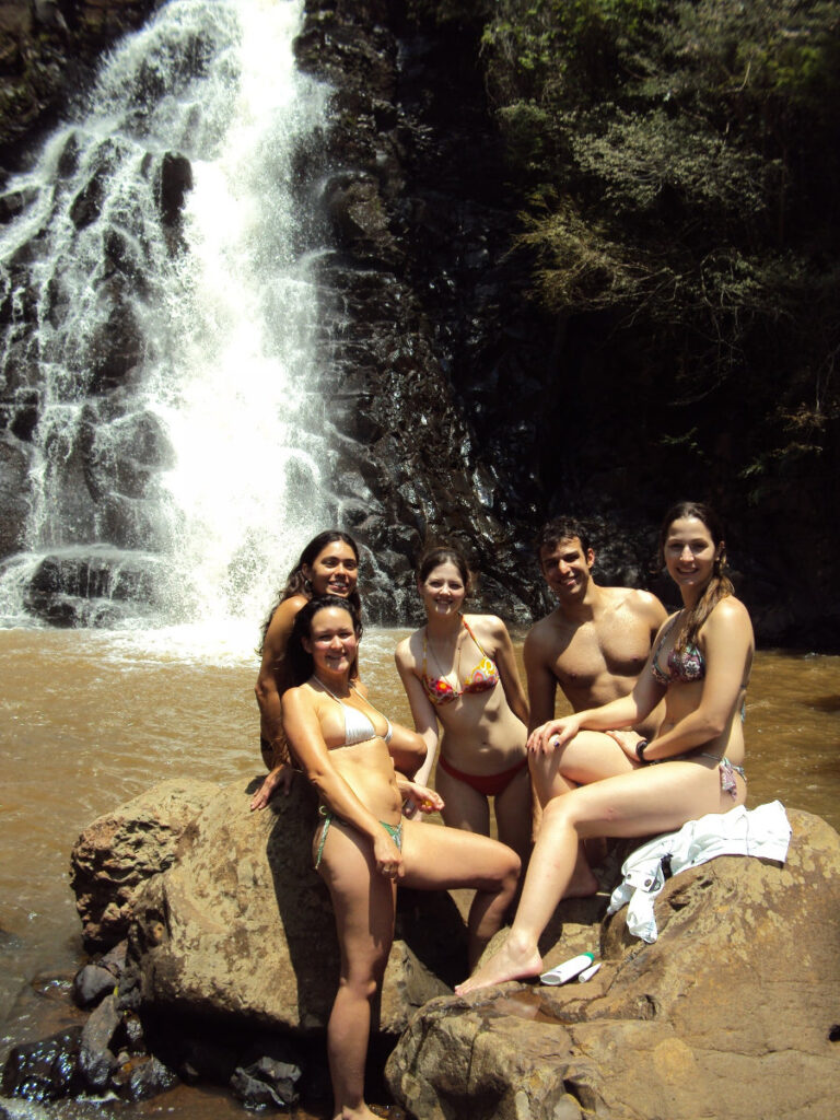 Group photo next to waterfall at Pavuna